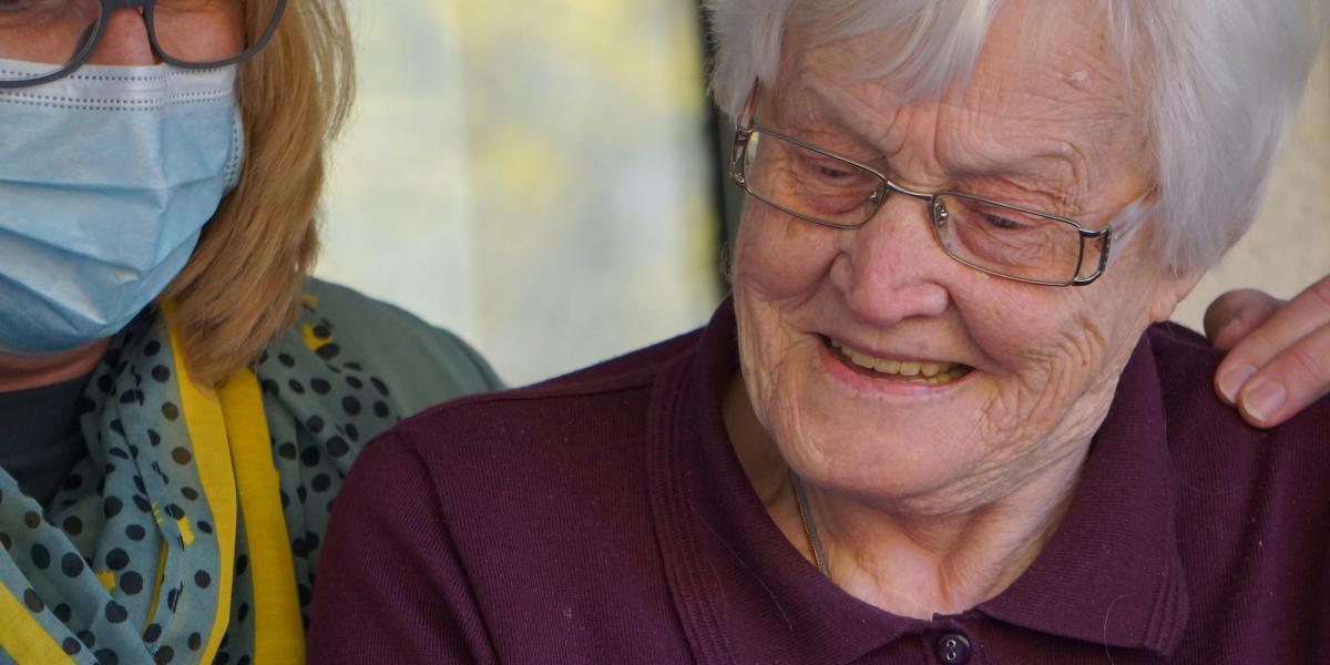 Elderly woman looking at relatives over zoom
