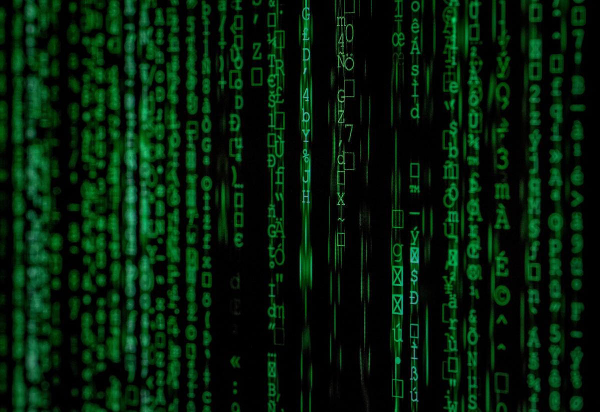 Strings of numbers and letters in green against a black background