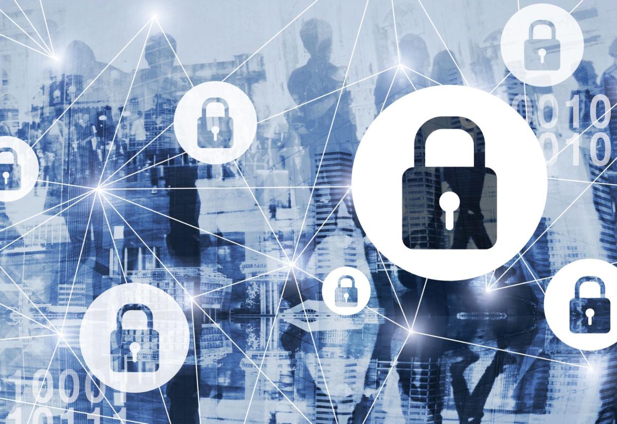 Abstract image showing interconnected padlock icons symbolising cybersecurity, overlaid on a blue-toned cityscape with silhouettes of people and binary code.